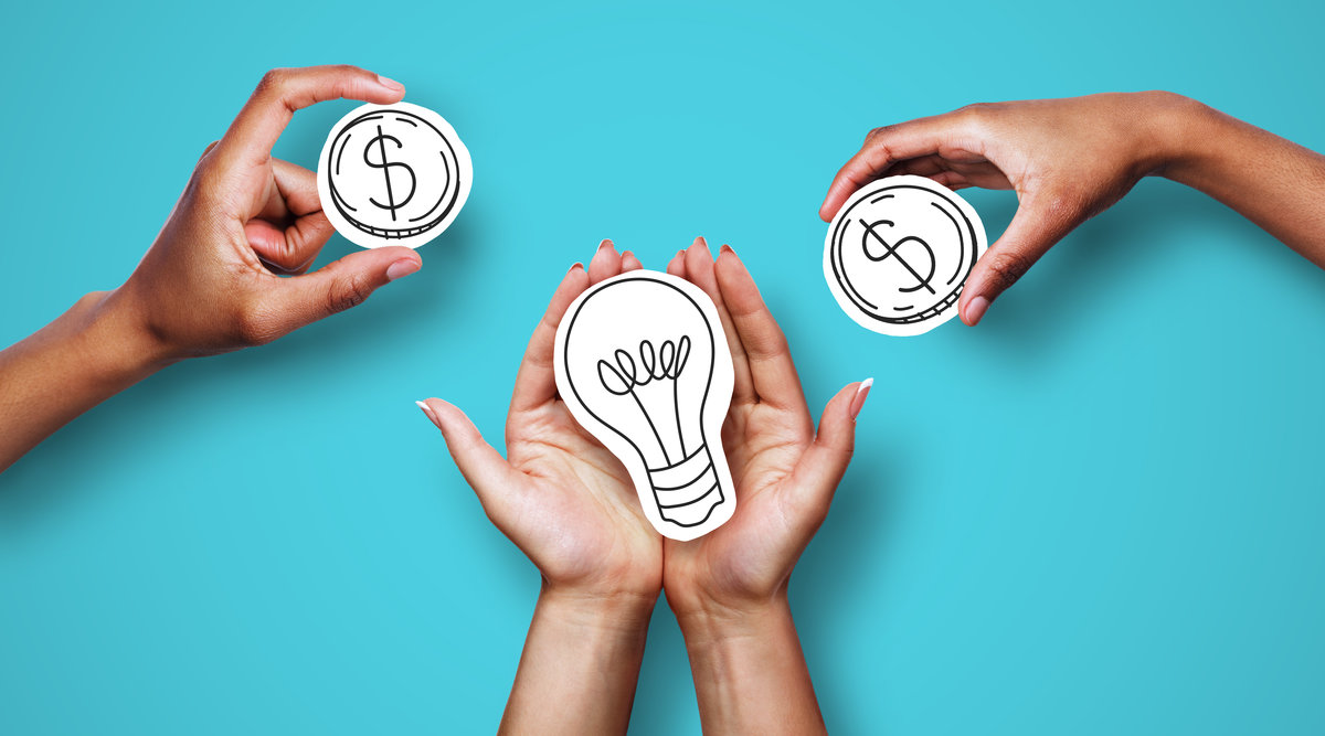 Money for startup, startup financing. Hands with dollar sign coins and light bulb over blue background, creator asking investors for money