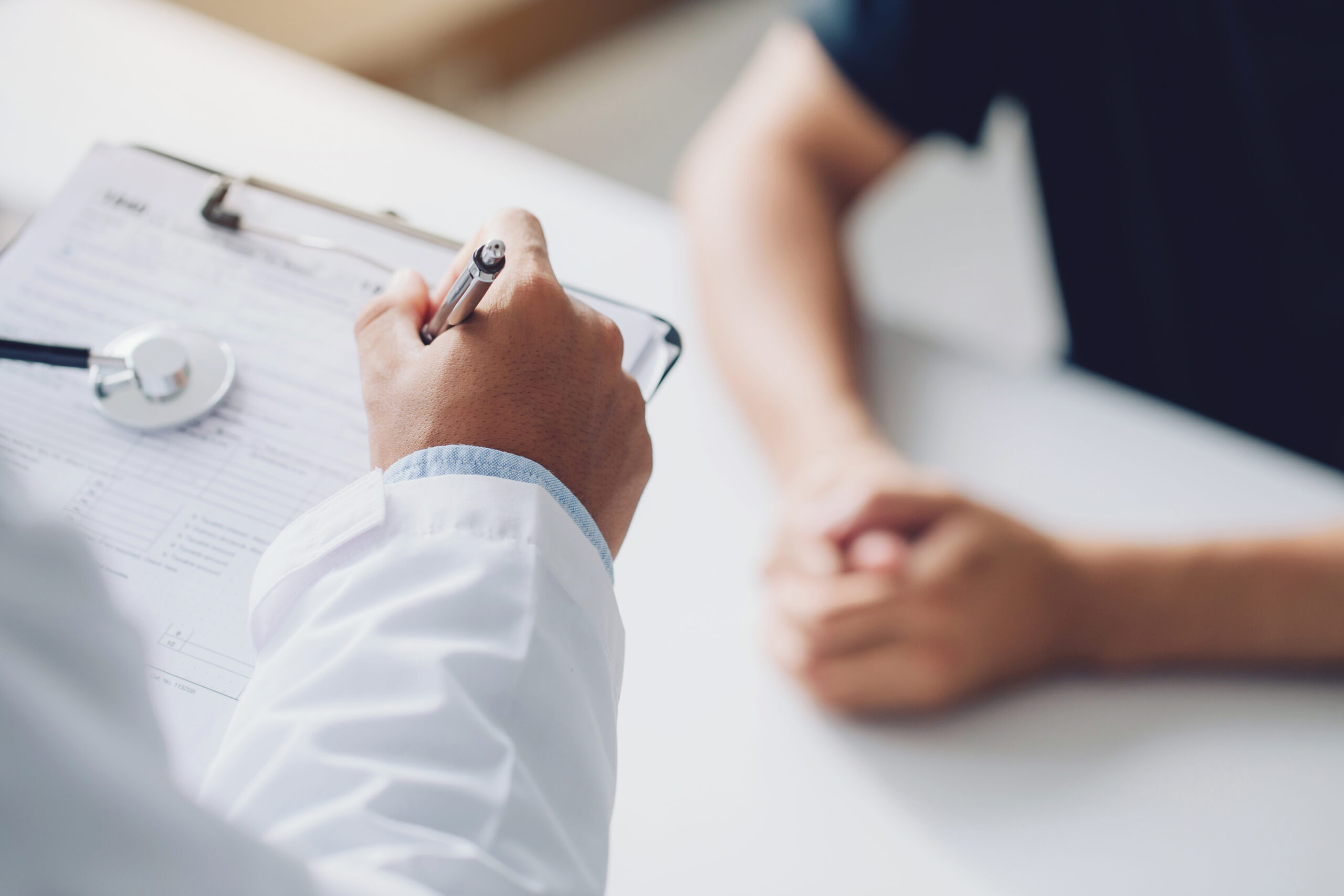 Doctor reviewing test results with a patient during a medical consultation