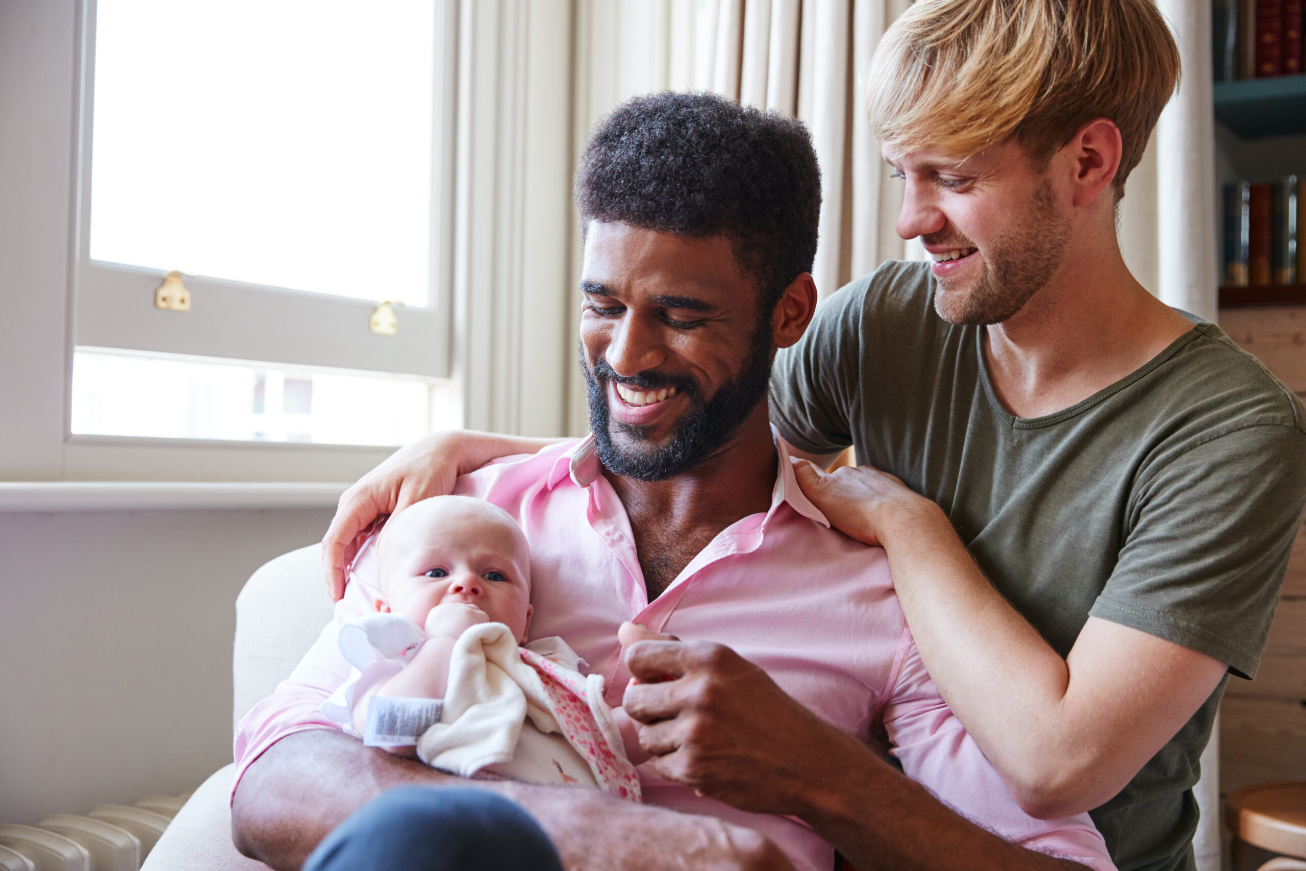 Same-sex male couple building their family through surrogacy and egg donation